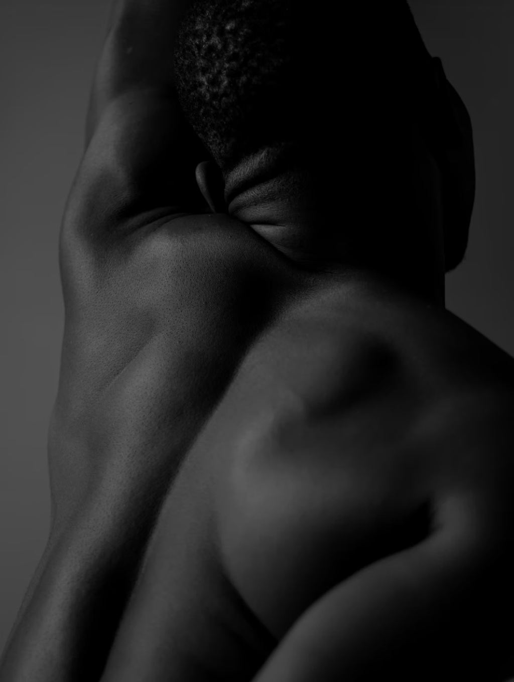 black and white photo of a male nude from behind